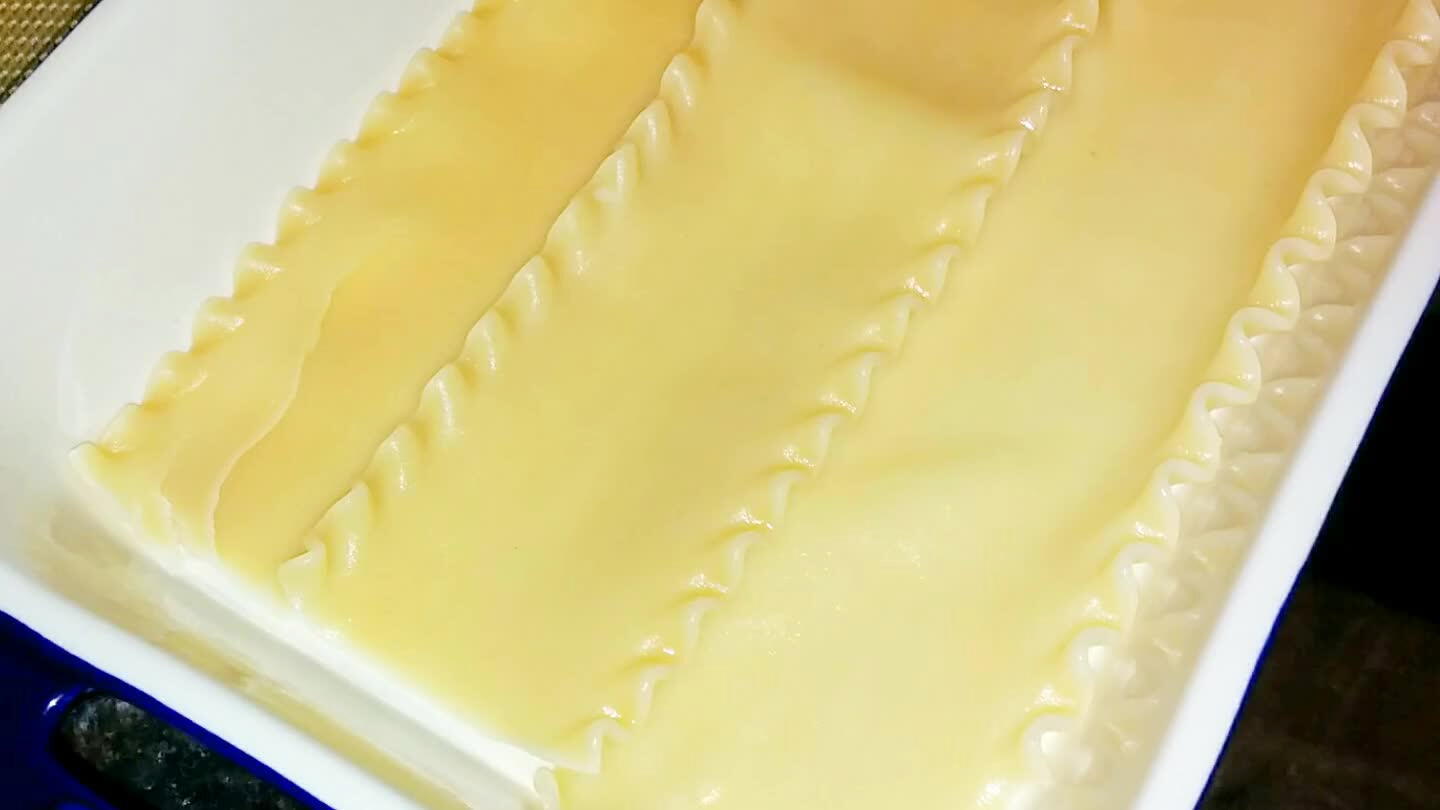 Line a casserole dish with the noodles.