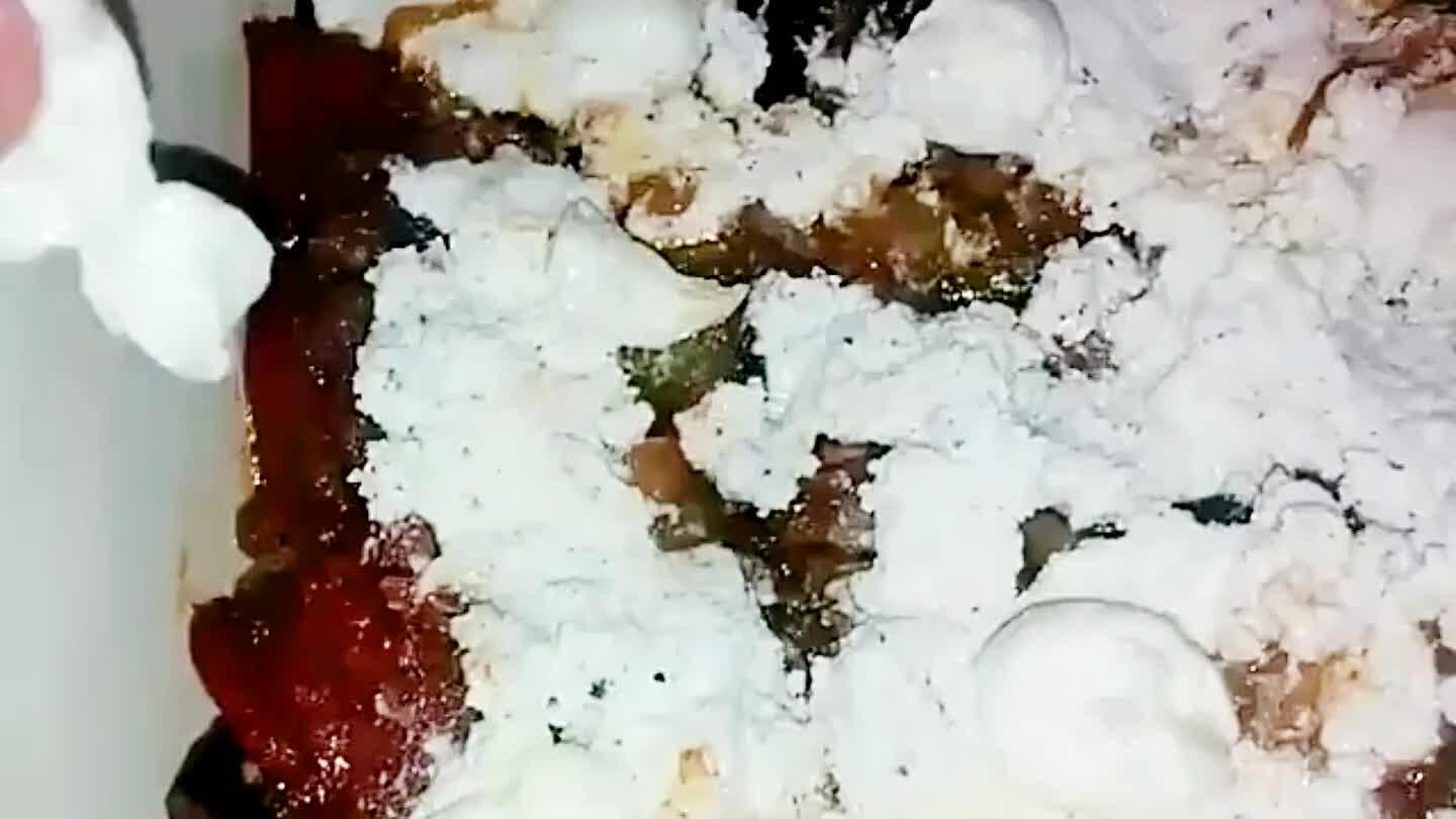 Break up some mozzarella and set it into the ricotta. These will be little gooey balls to chance into later.