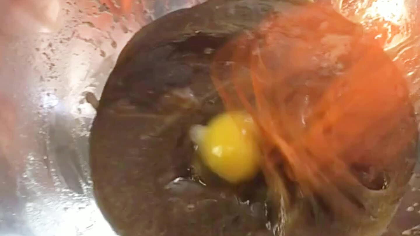 Whisk in the eggs, one at a time.