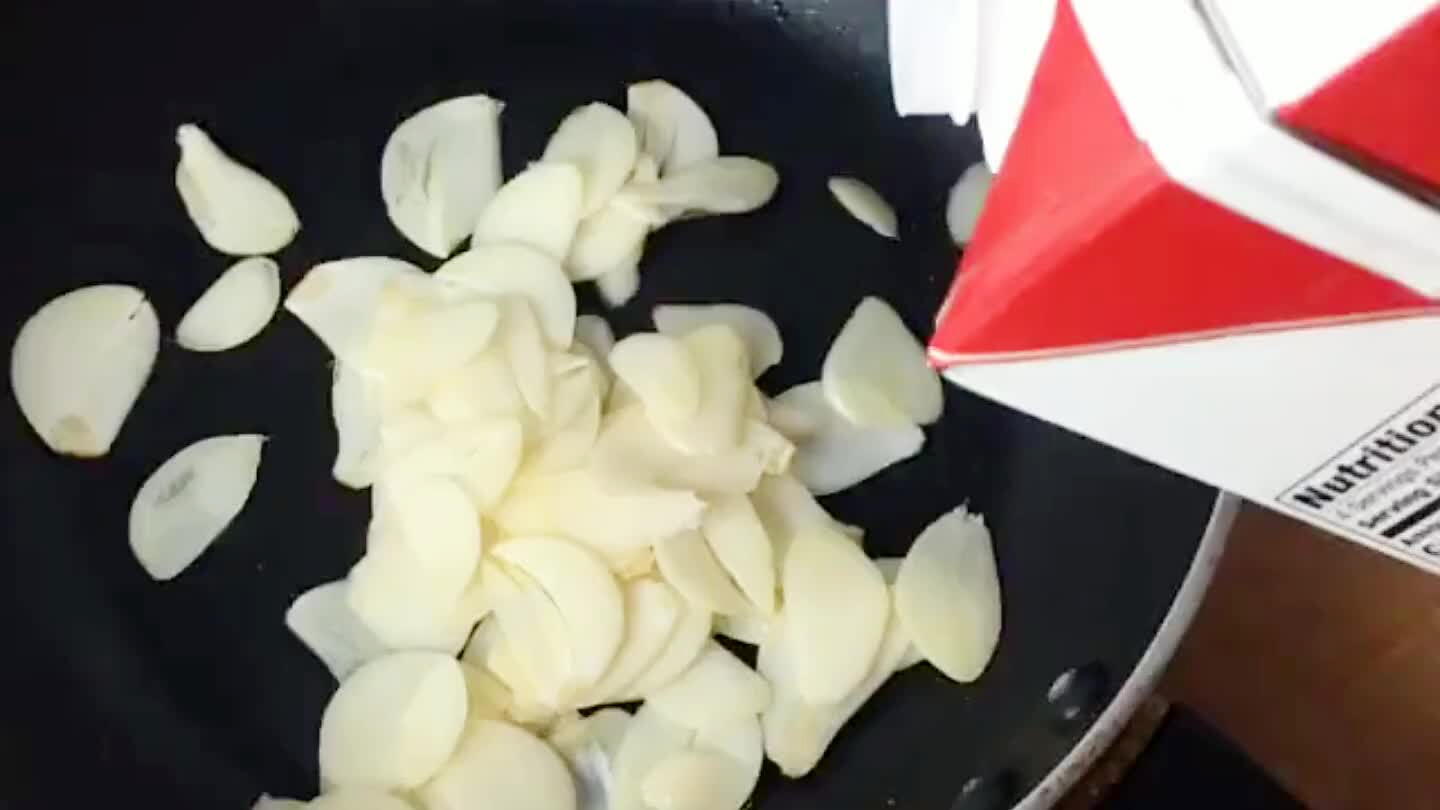 Place garlic slices in a small pan and cover with milk. Bring just to a boil.