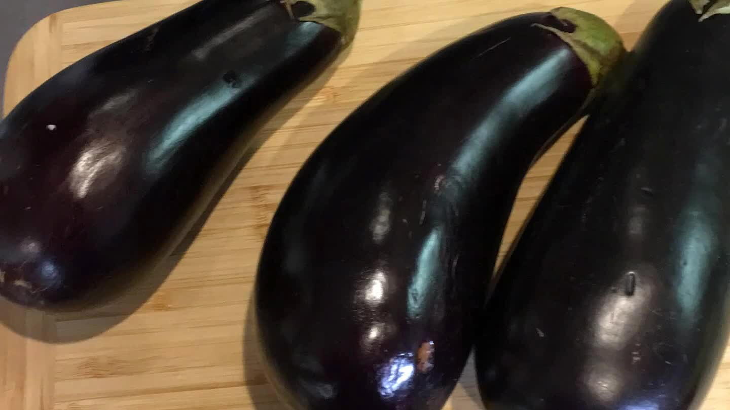 , both sides seasoned with salt. This will help remove some moisture from the eggplant.