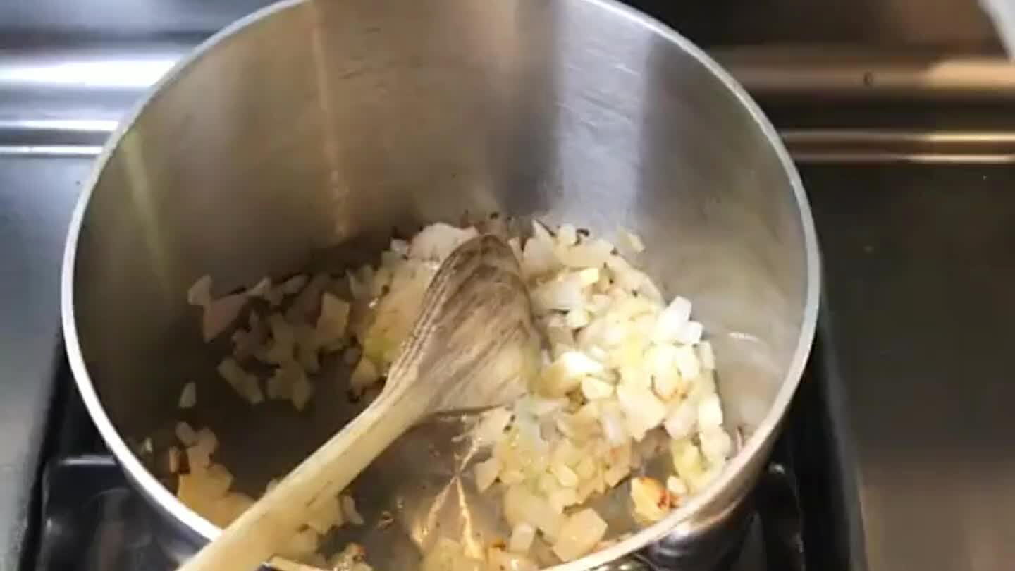 Add the arborio rice, stir well, add the wine and stir well. Cook until rice starts to become transparent
