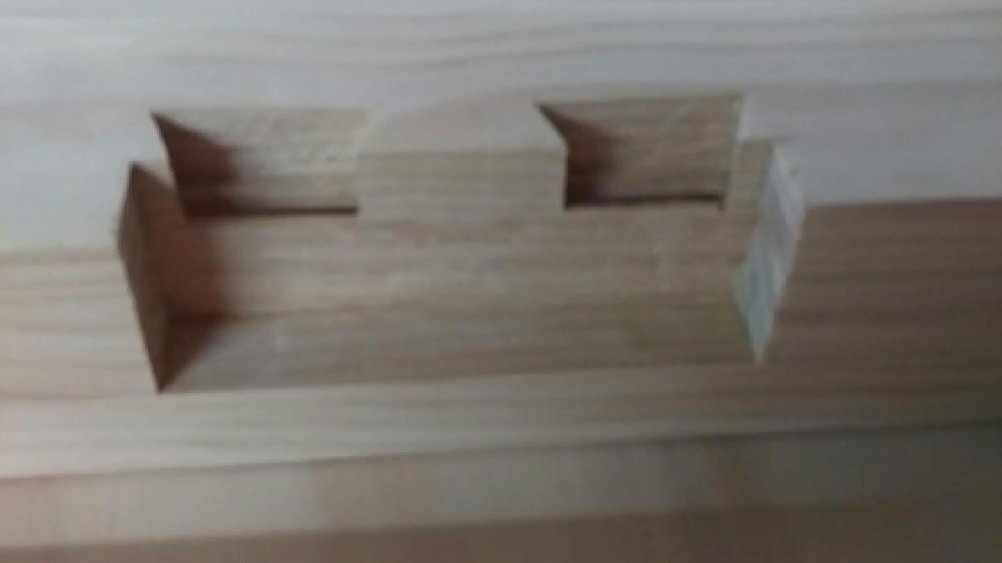 . Cut a 5.5 wide by 1.5" deep notch in them to accept the bed frame. (Note: Ignore the dovetails in the photo... not necessary using these instructions.)
