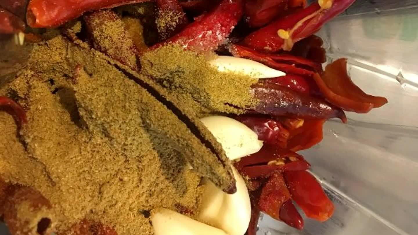 Place the chilies and the remaining ingredients (except for the olive oil) in a blender or food processor.