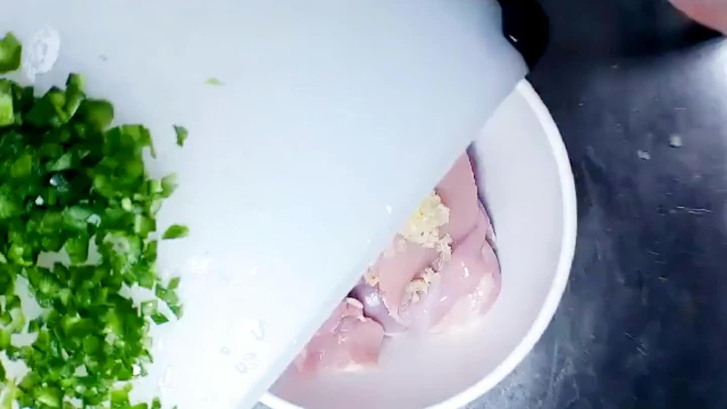 First add the garlic and brunoise chili to the chicken.