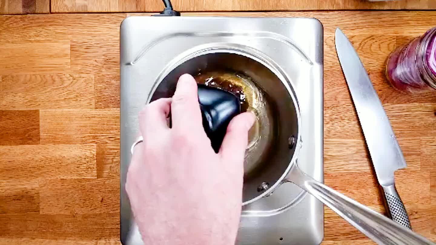 Combine vinegar, salt and sugar in a saucepan. Bring to a simmer.