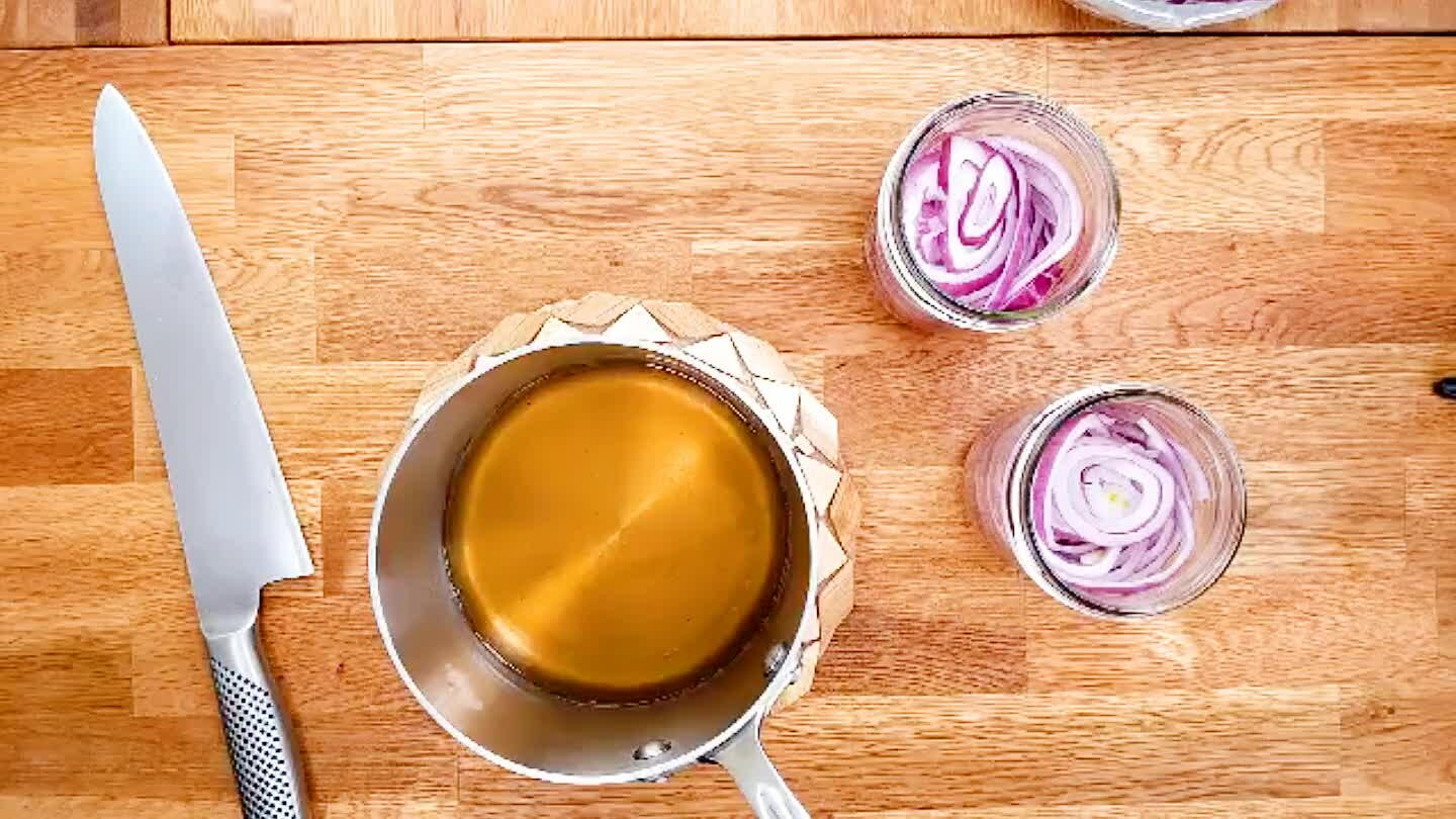 Pour the hot pickling liquid over the sliced onions. Seal the containers, and refrigerate. They're ready to eat within an hour or so, and they'll keep for a couple of weeks.