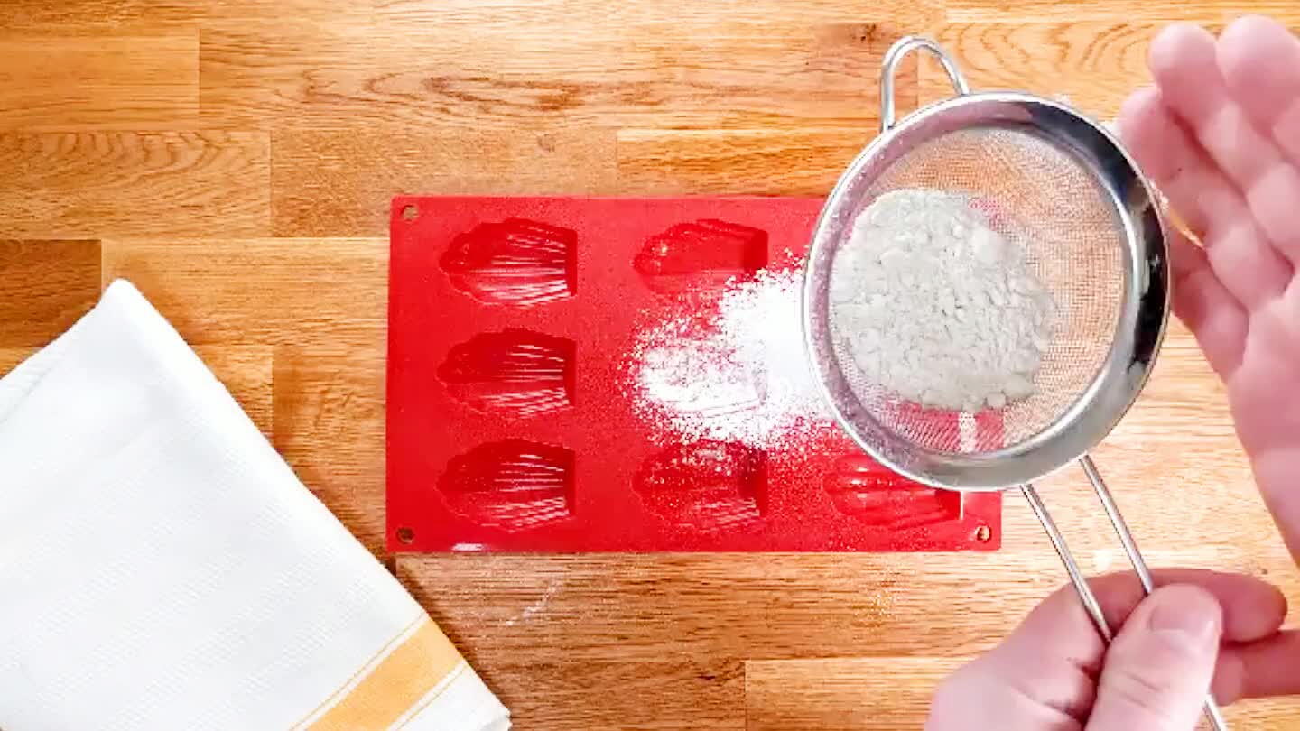 ur over the mold. Make sure the mold is coated well, and knock off any excess flour.