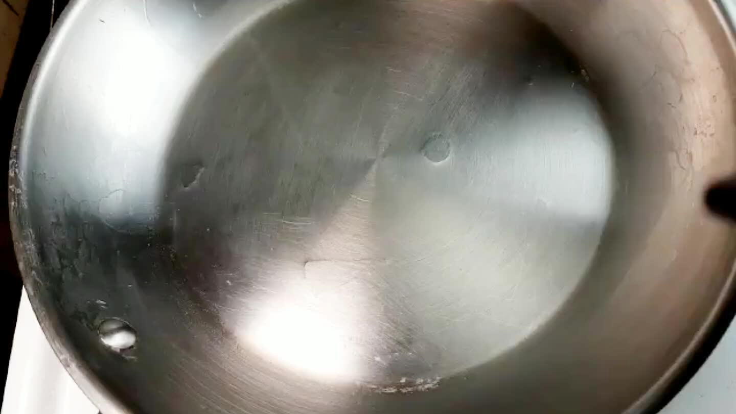 In a large pan, dissolve the sugar into the water over high heat, stirring frequently.