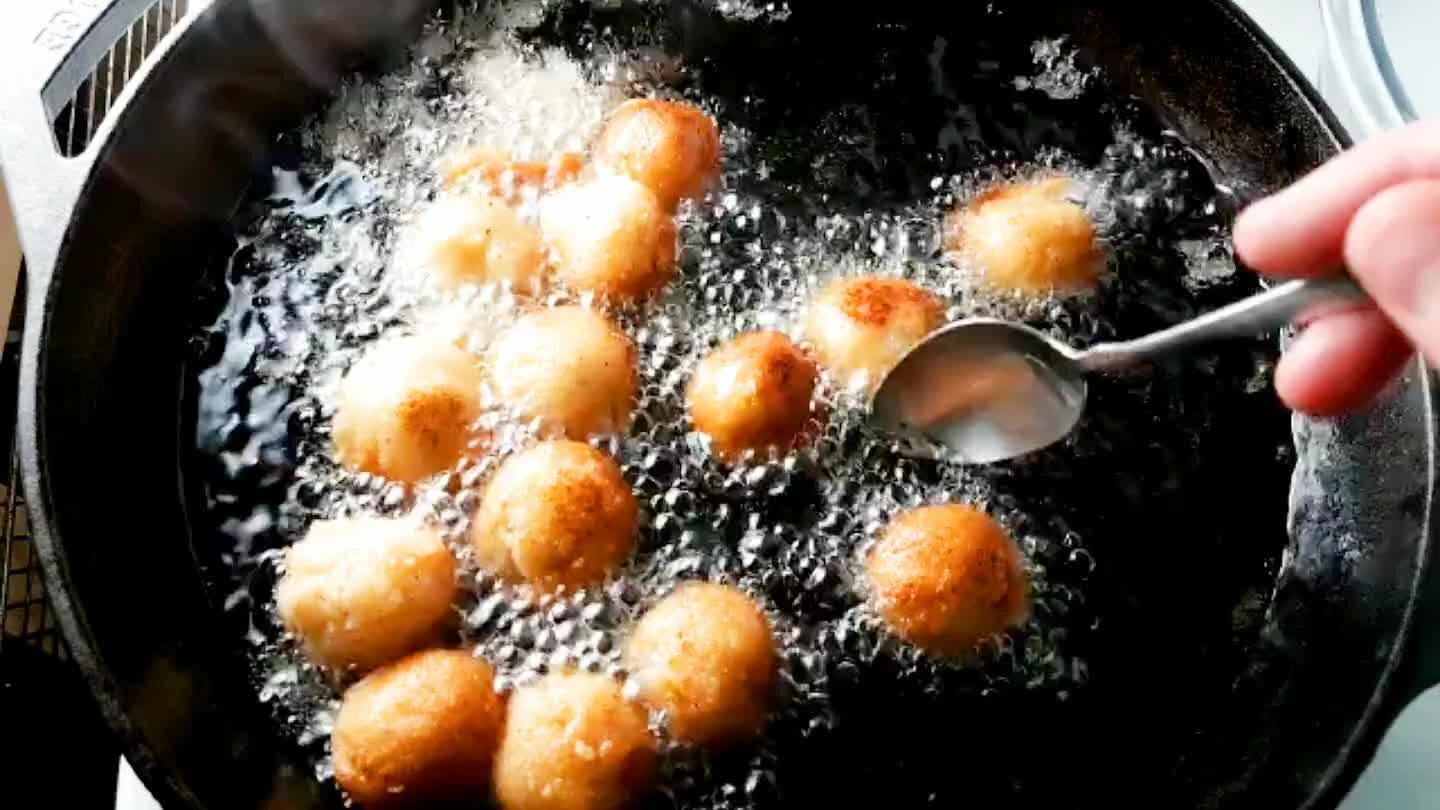 They're done cooking when throughly coated in a nice shade of golden brown.