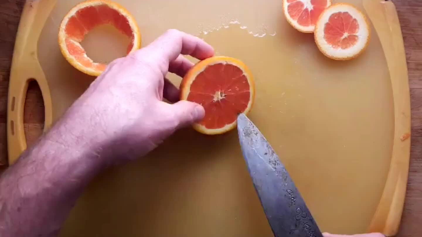 he orange slice on it's skin and slide the knife between the skin and the meat.