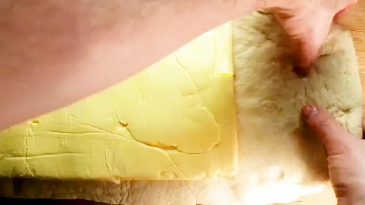 er. It should cover the butter about 1/2 way. Now fold the left third of the dough, along with the butter, up and over the top.