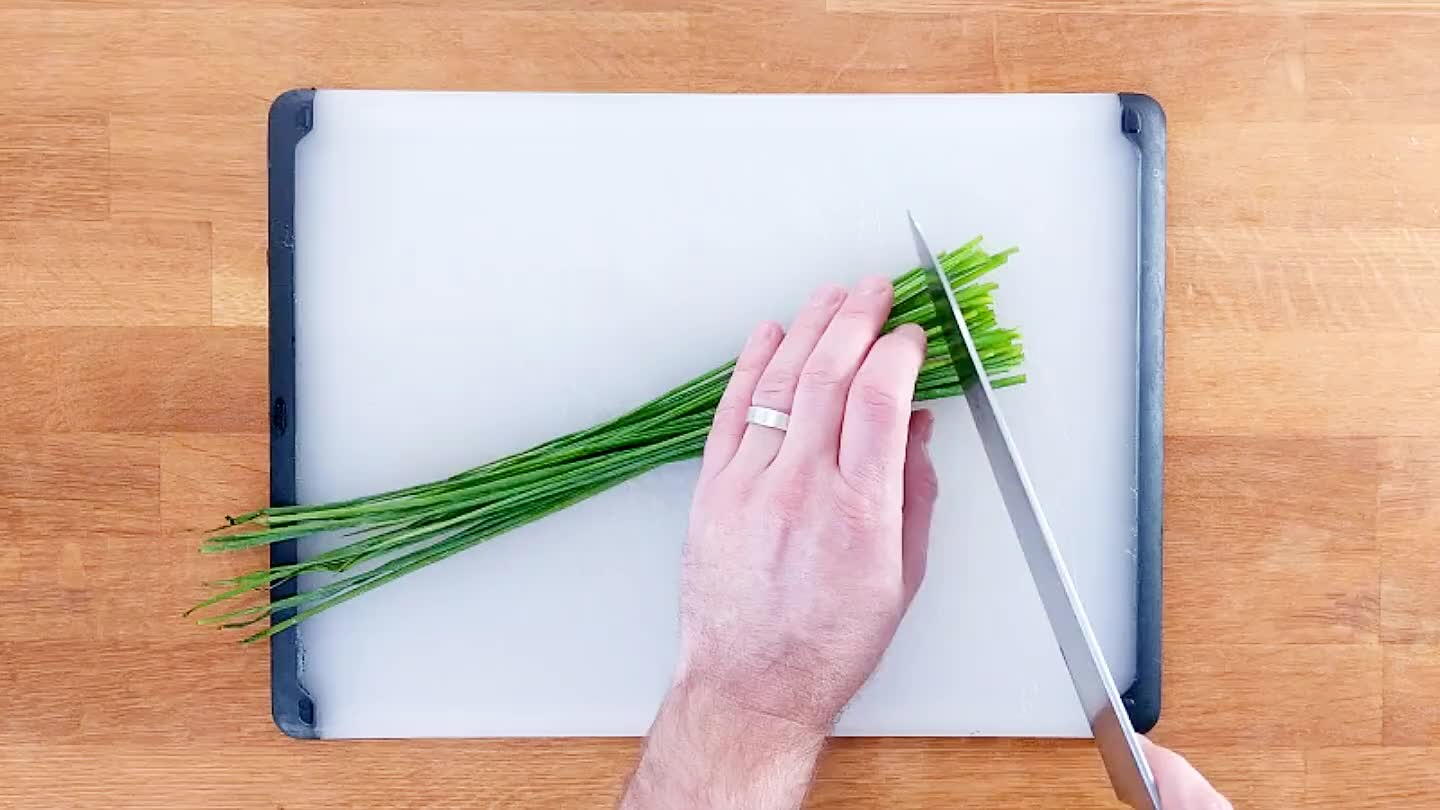 I do this step is to shorten the work by half. Now slice your chives uniformly.