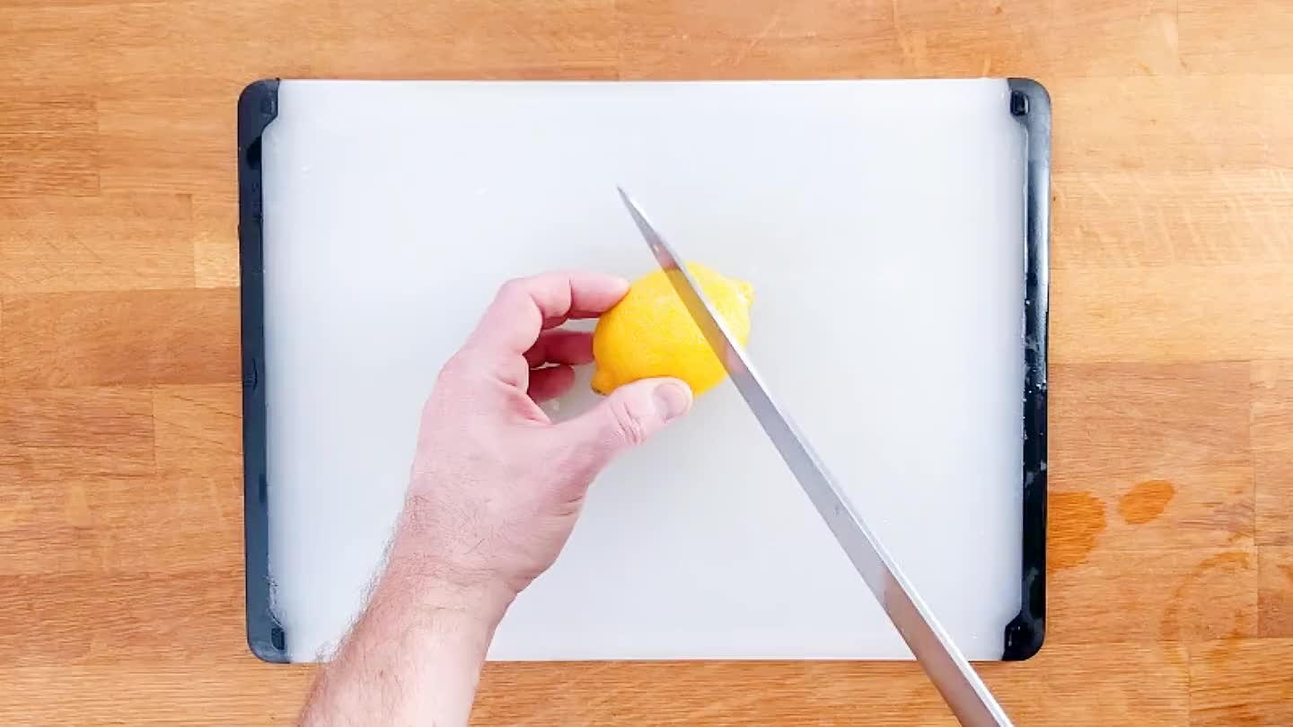 Juice the lemon into the apples.
