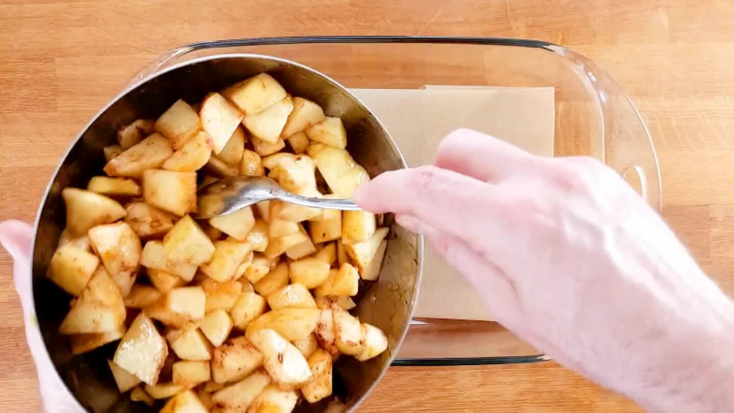 Arrange the apples in a parchment-lined baking dish.