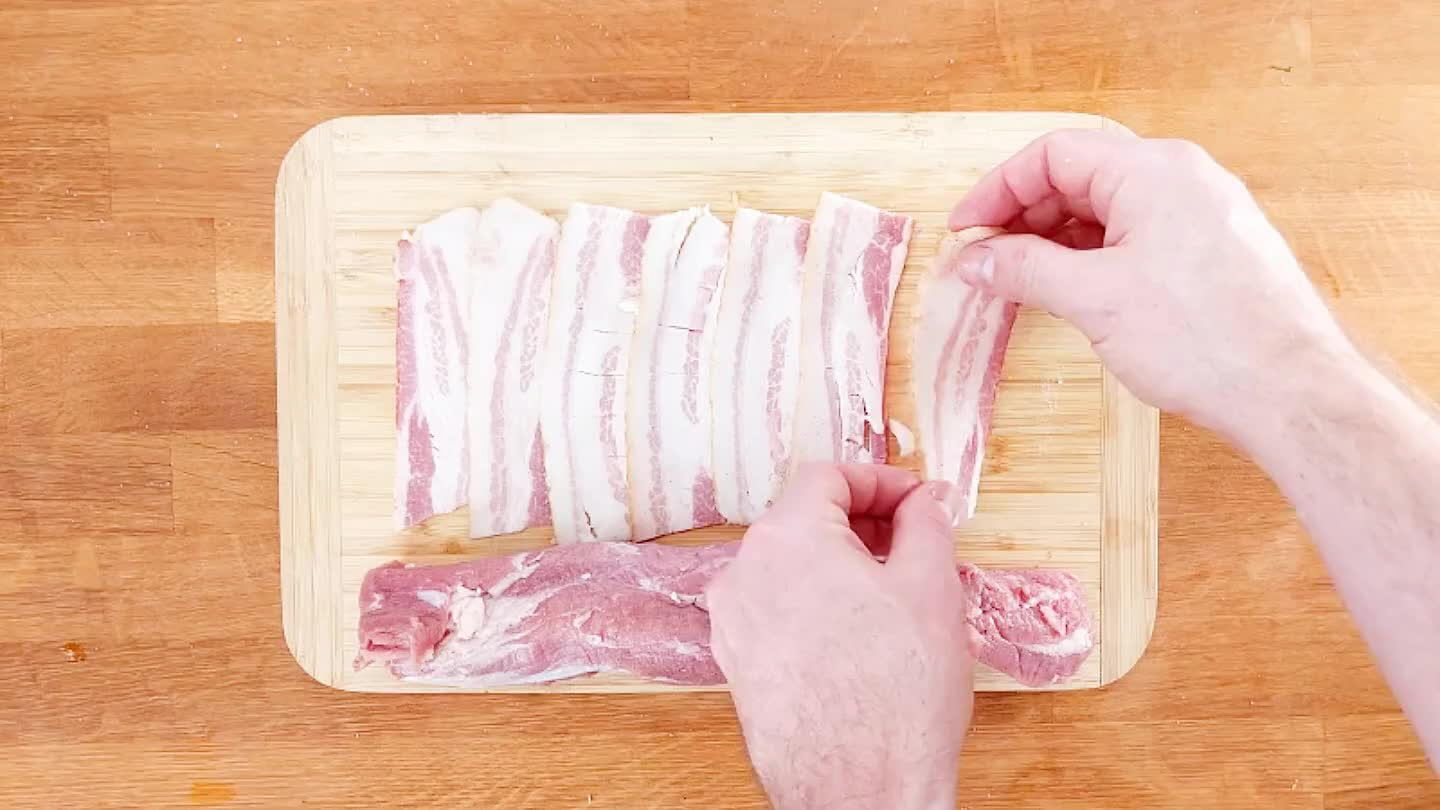 tenderloin. Arrange on a cutting board with edges overlapping. Place tenderloin on top and roll tightly.