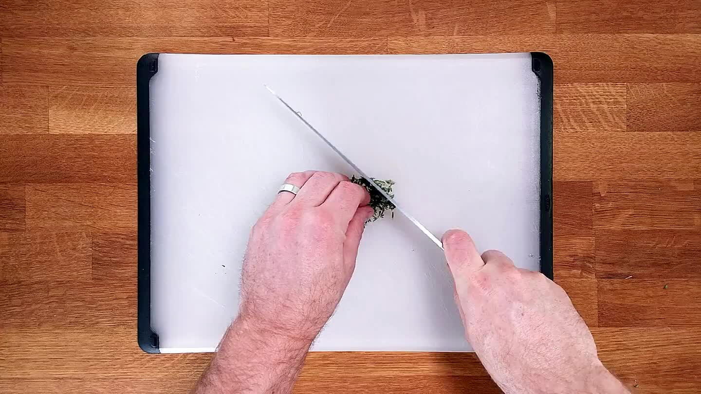 k your knife rapidly up and down while moving it through the pile of thyme. Repeat until finely chopped.