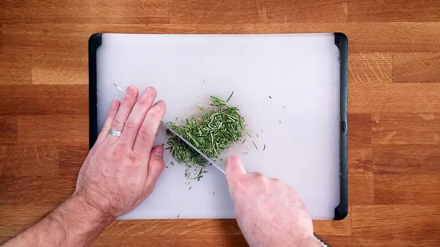 k your knife rapidly up and down while moving it through the pile of rosemary spears. Repeat until finely chopped.
