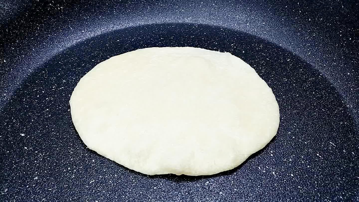works great for this. Peel your tortilla from the press and place it into the pan. It should begin to bubble after a minute or so.