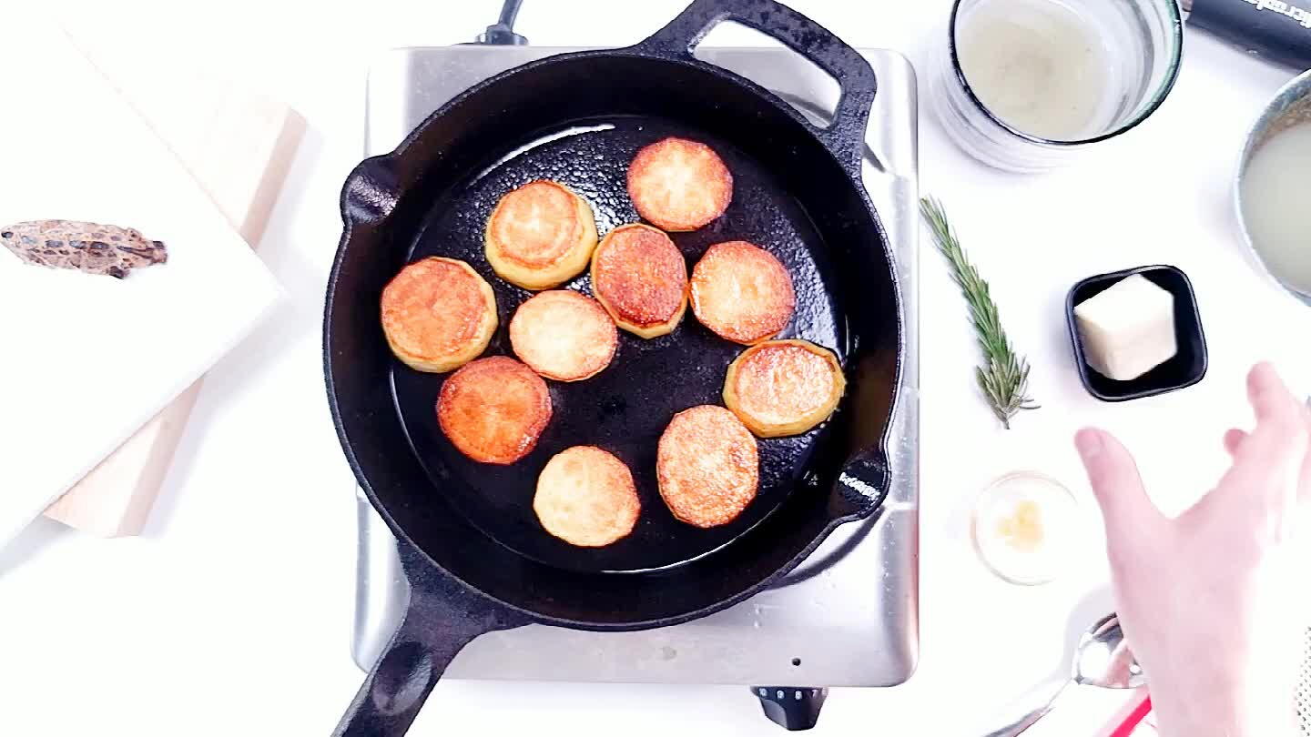 the rosemary and garlic will infuse it. Using a large spoon, baste the potatoes with some of this flavored butter.