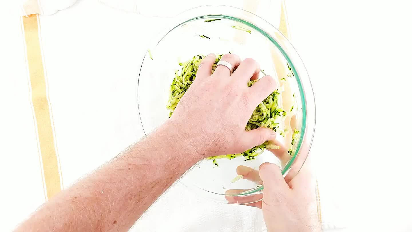 a bowl to squeeze away as much moisture as possible.