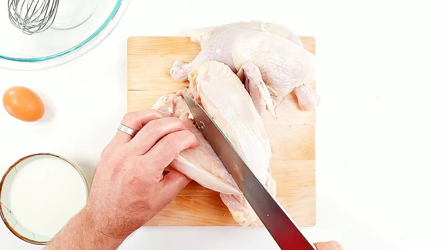 Slice along the breast bone until the breast is held only at the point where the wing joins the shoulder.