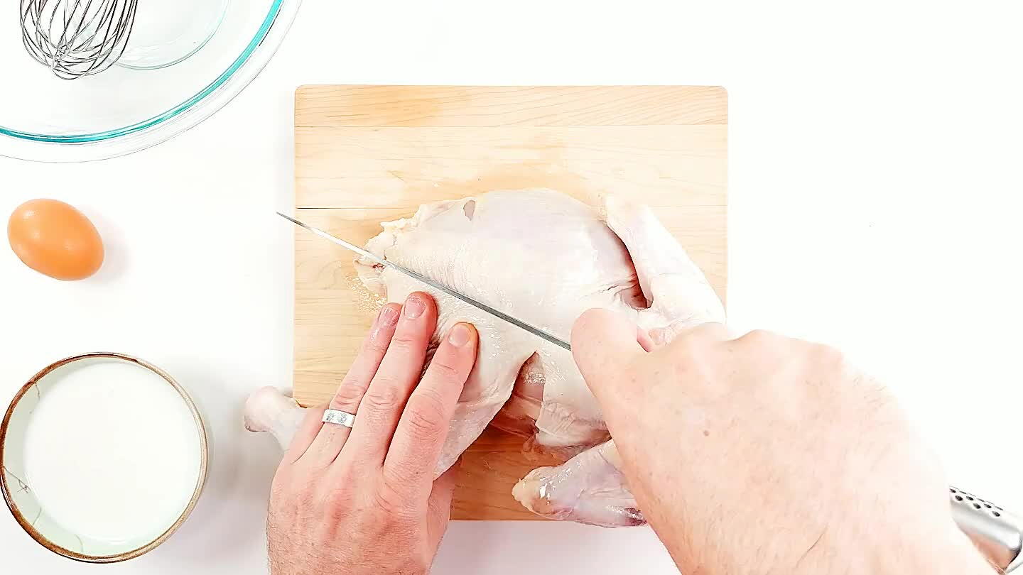 Slice between the thigh and breast, then down the back along the spine.