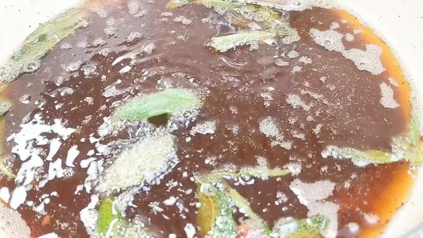 the hot oil. They will probably sputter a lot. Fry the herbs for about 30 seconds, just until translucent, then remove and drain.