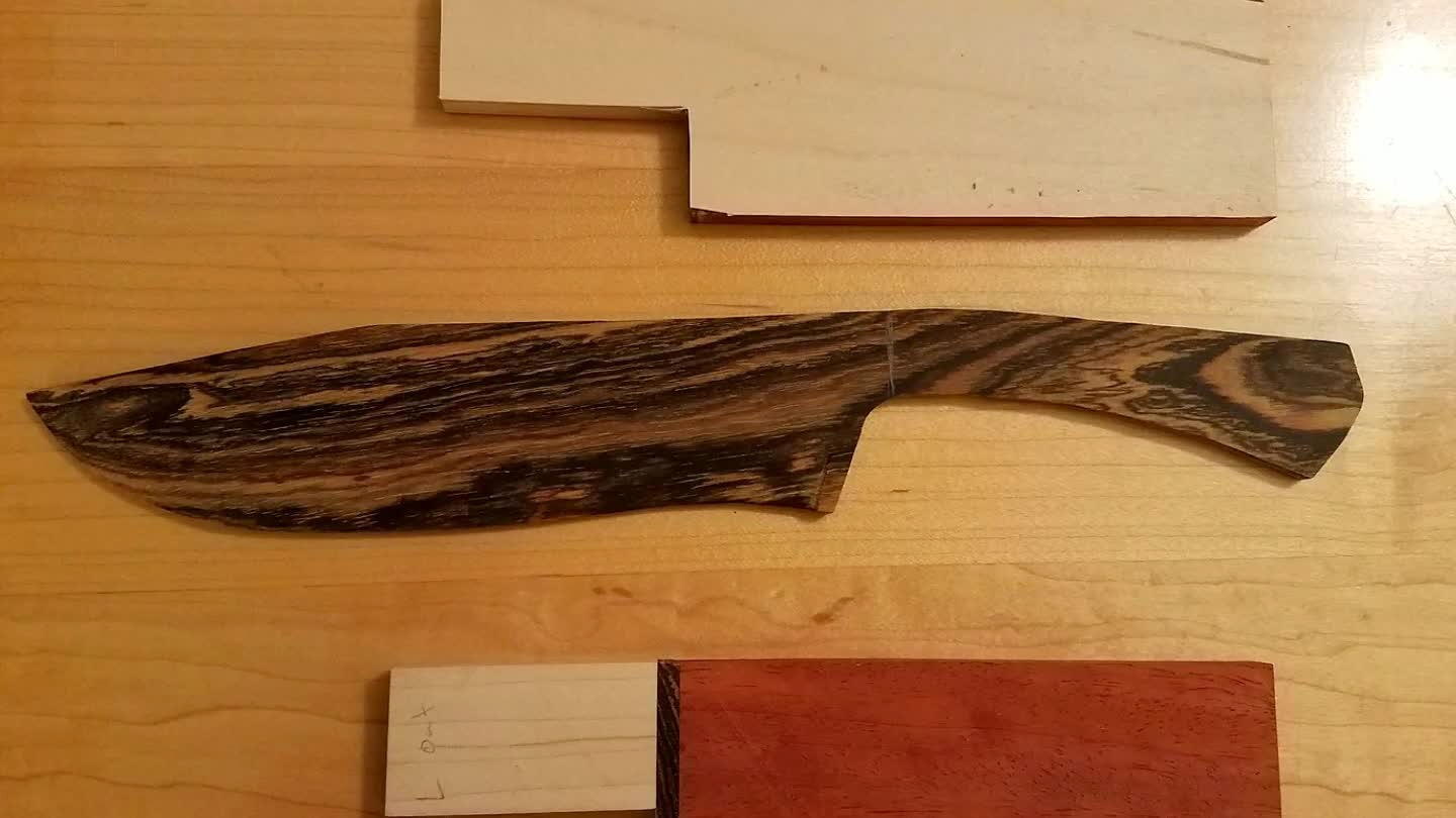 separate pieces and glued maple veneer to the inner surface of each piece to serve as the blade liner.