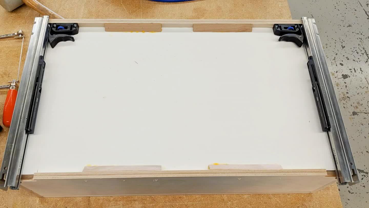 ck corners for the slide to sit on. Then I attached the clips with 1/2" screws and drilled a 1/4" hole for the little hooks in the back of the slides.