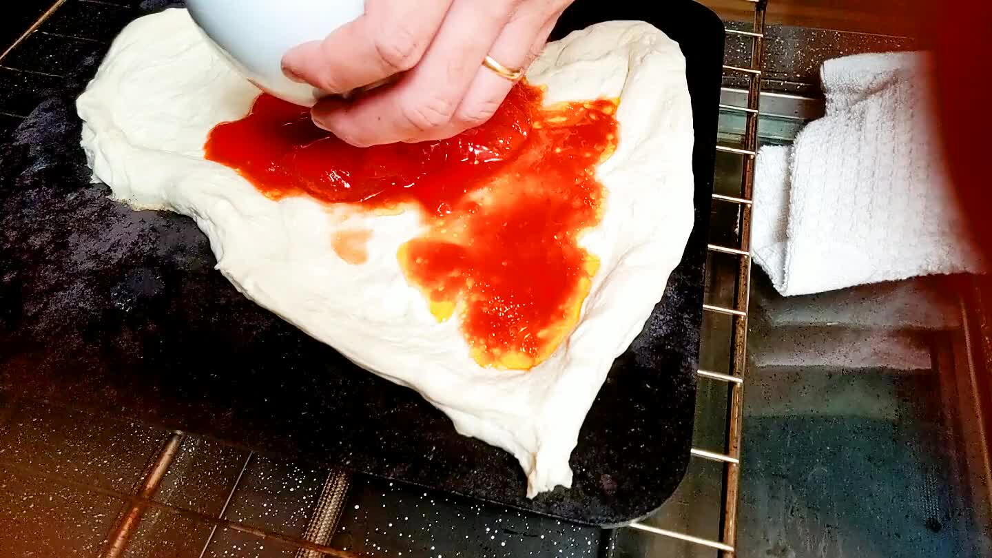 or stone. I prefer cast iron as the bottom part of the dough needs lots of heat to cook. Add the tomato sauce right away to cook together.