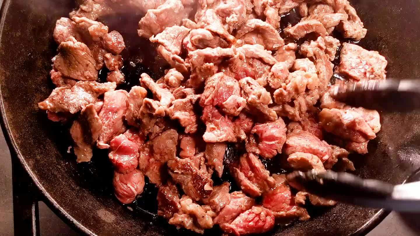 hunks are browned and cooked through. Remove the cooked beef from the pan and set aside.