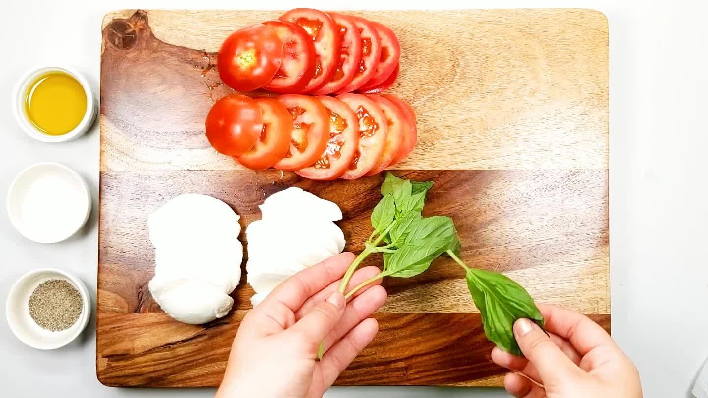 l be layered in whole leaves between the tomato and mozzarella.