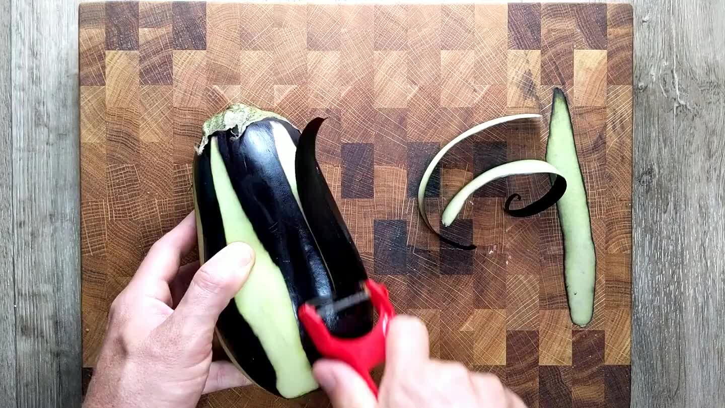nly spaced strips around the eggplant leaving about half of the skin attached.
