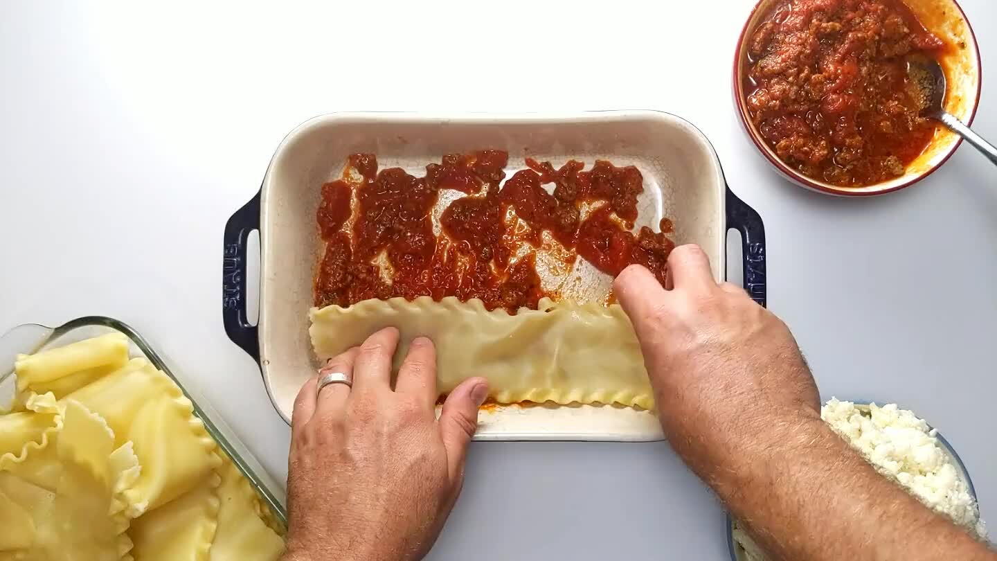 ish. Trim the noodles to fit. Save the nicest noodles for the top and bottom layers.