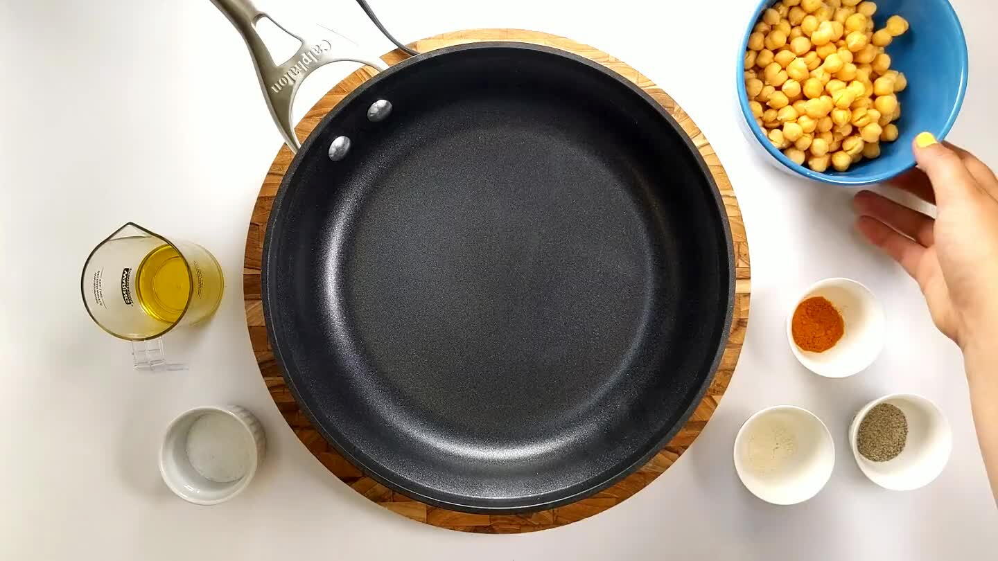 t over medium-high heat. Add chickpeas, turmeric, garlic powder, salt and pepper to the pan.