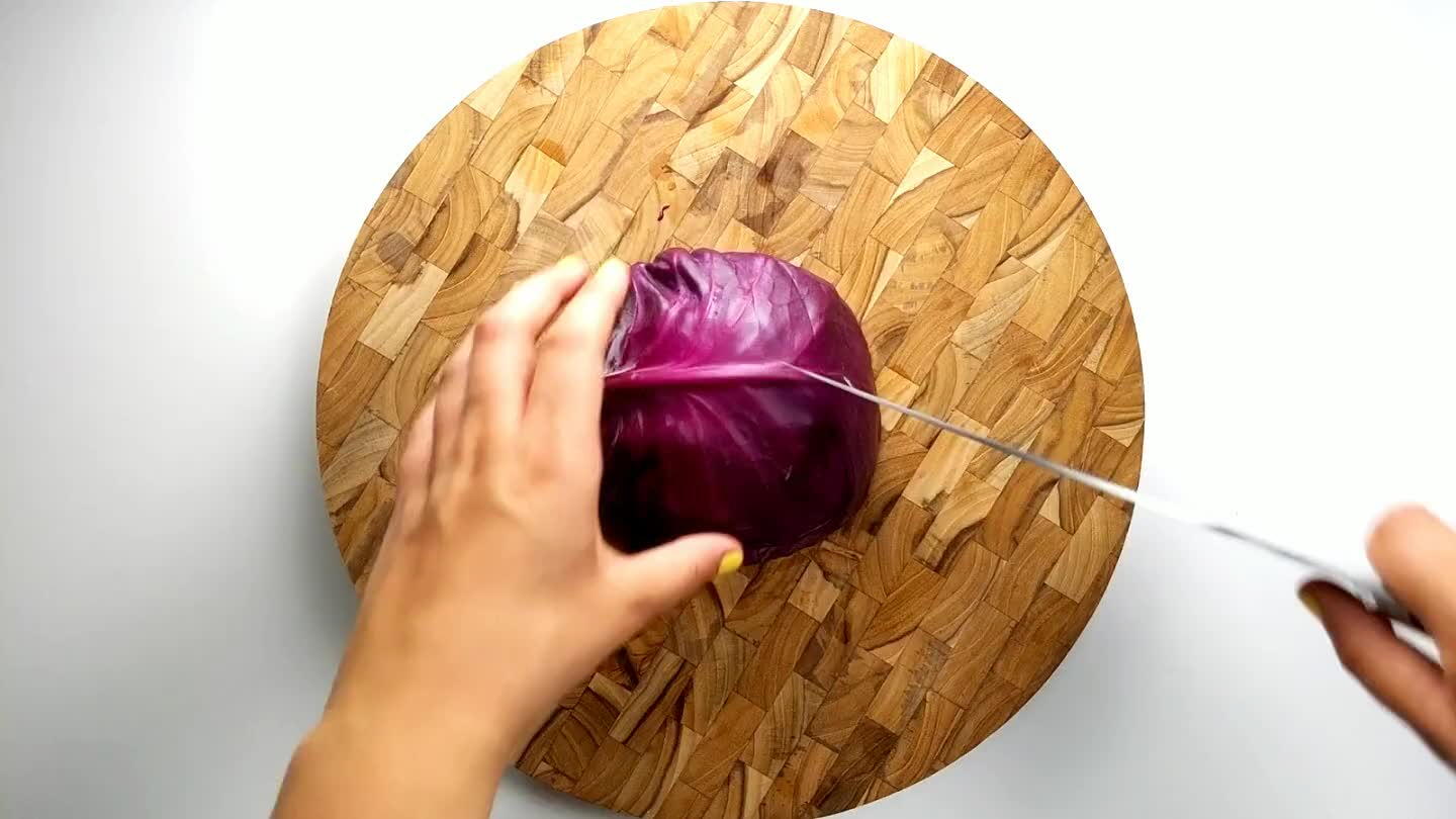 wo slices into the cabbage, leaving the stem in tact. Shred the cabbage by slicing super thin strips.