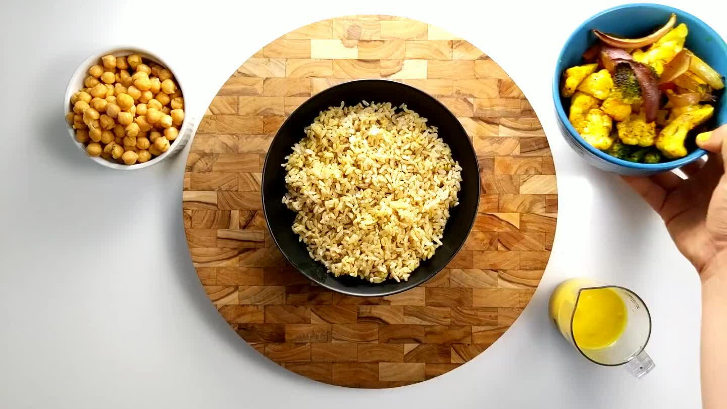 s and chickpeas. Drizzle with turmeric tahini dressing, mix, and serve immediately.
