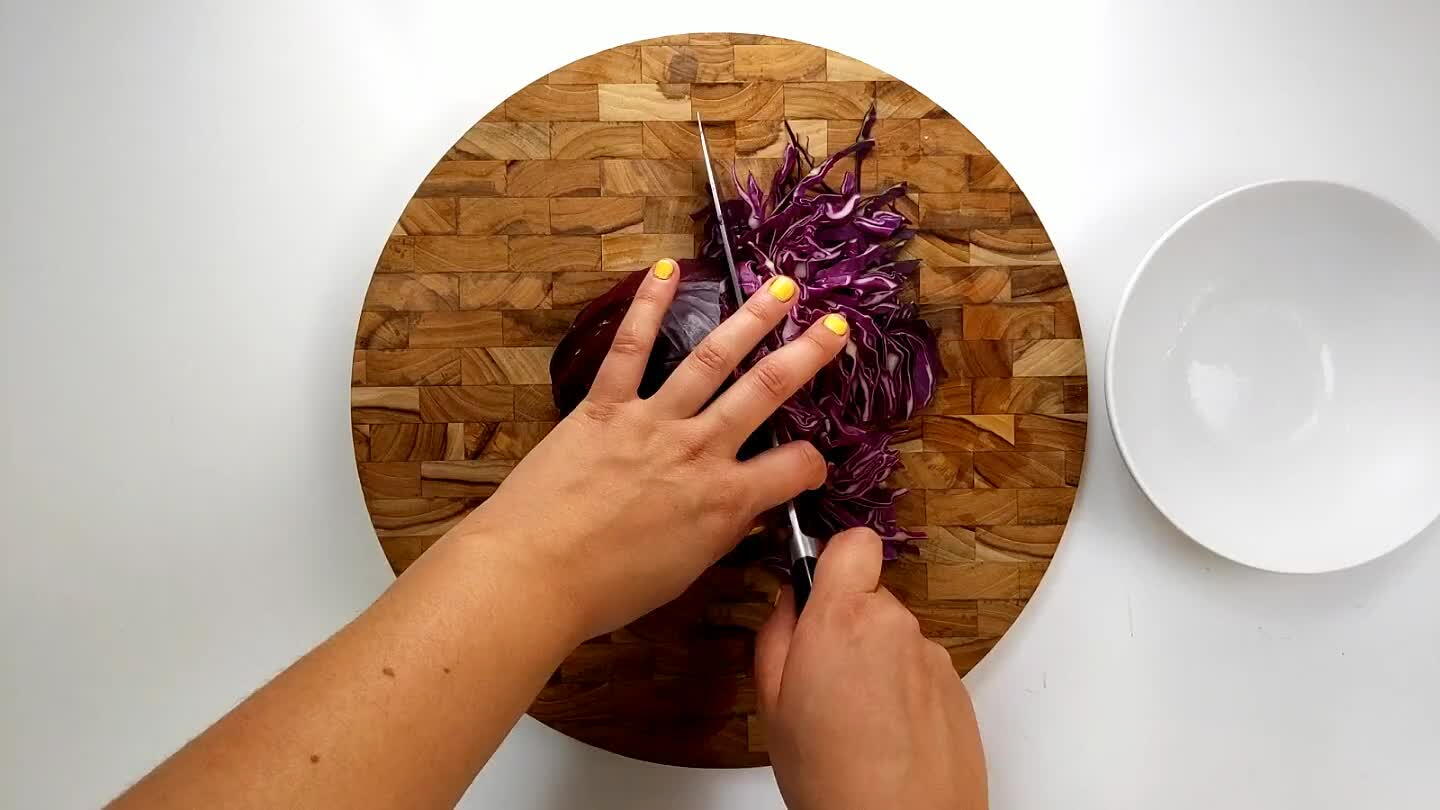 ice two times into the cabbage keeping the stem in tact. Cut thin strips of cabbage to achieve this shredded texture.