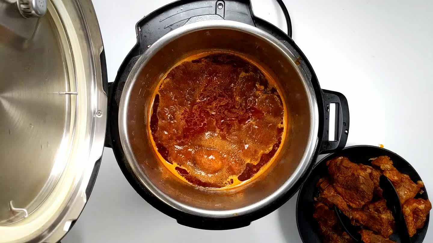 by half, about 15 minutes. When sauce has thickened, use tongs or two forks to shred the pork.
