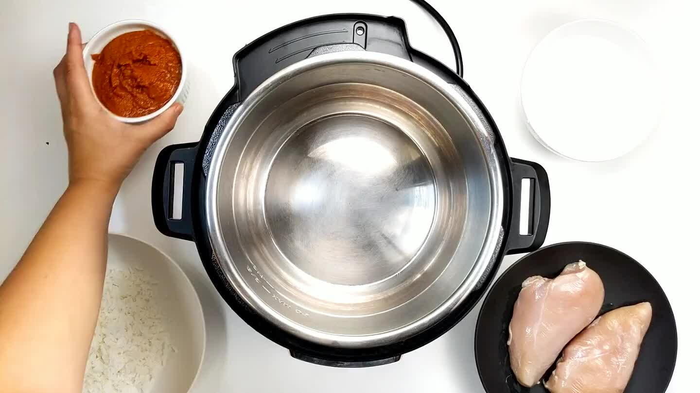 on the bottom. Lay the whole chicken breasts inside and coat the top with the rest of the sauce.