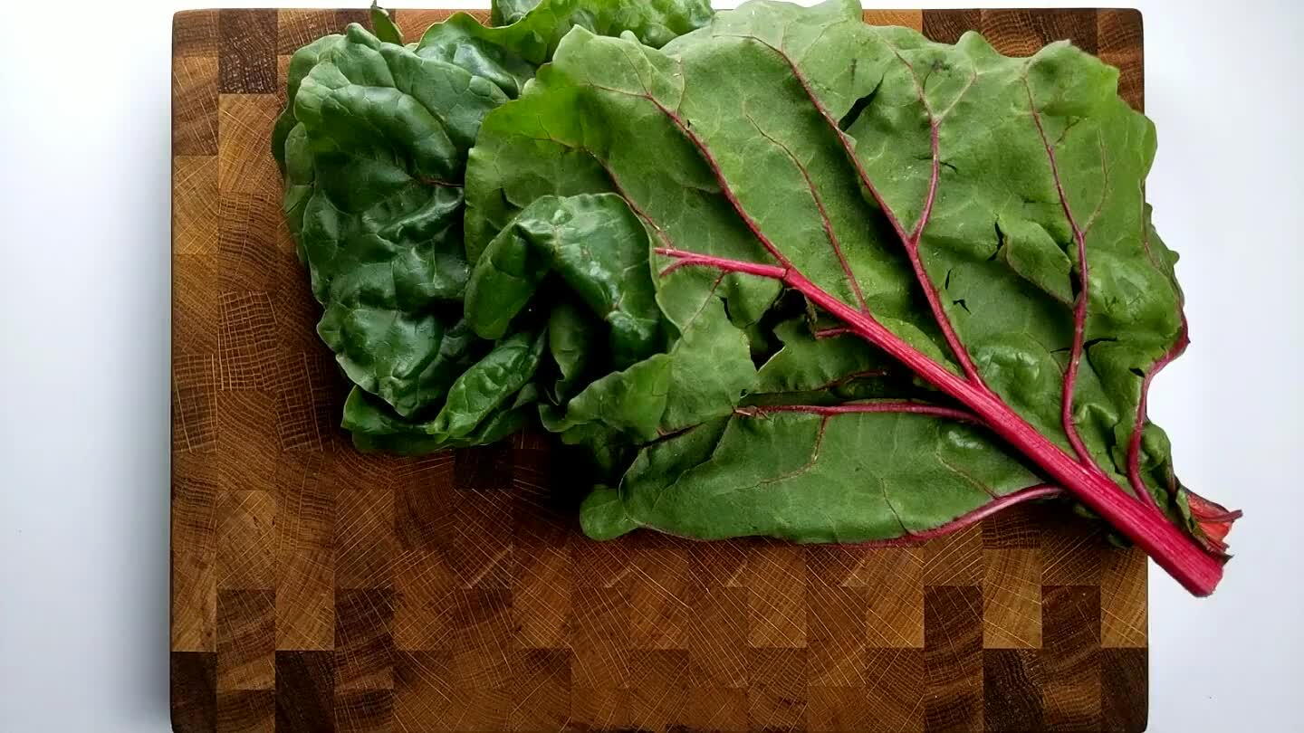 and dragging the stem out through pinched fingers. Roll up the leaves and slice.