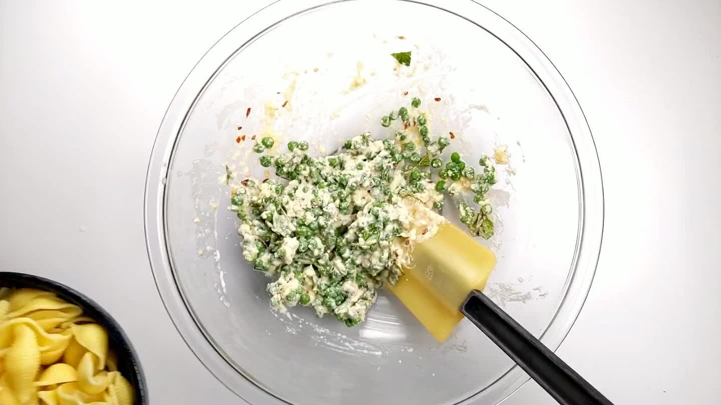 gh to warm the cream, melt the cheese and heat the frozen peas through.
