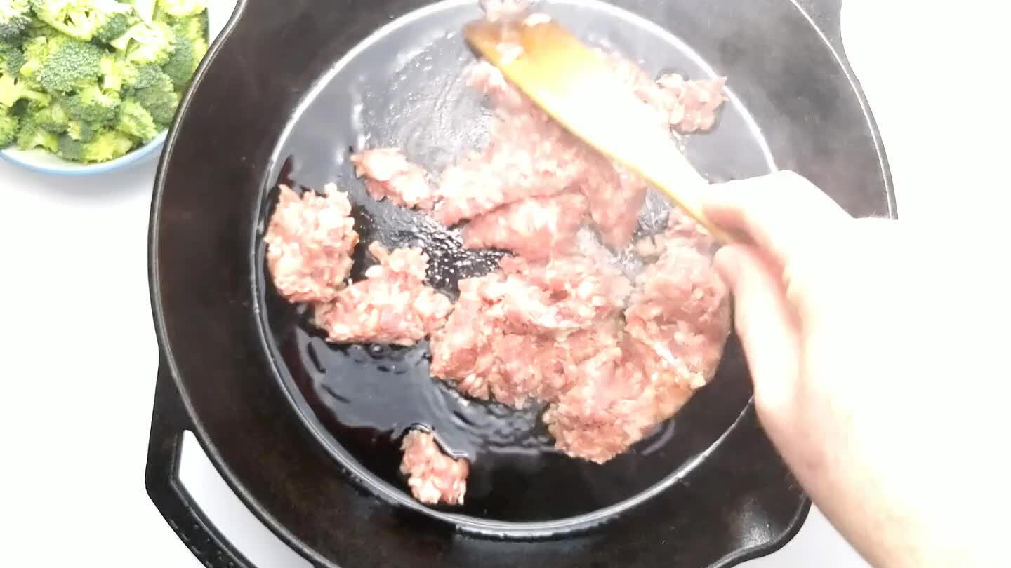 the broccoli is tender and the sausage is cooked through.