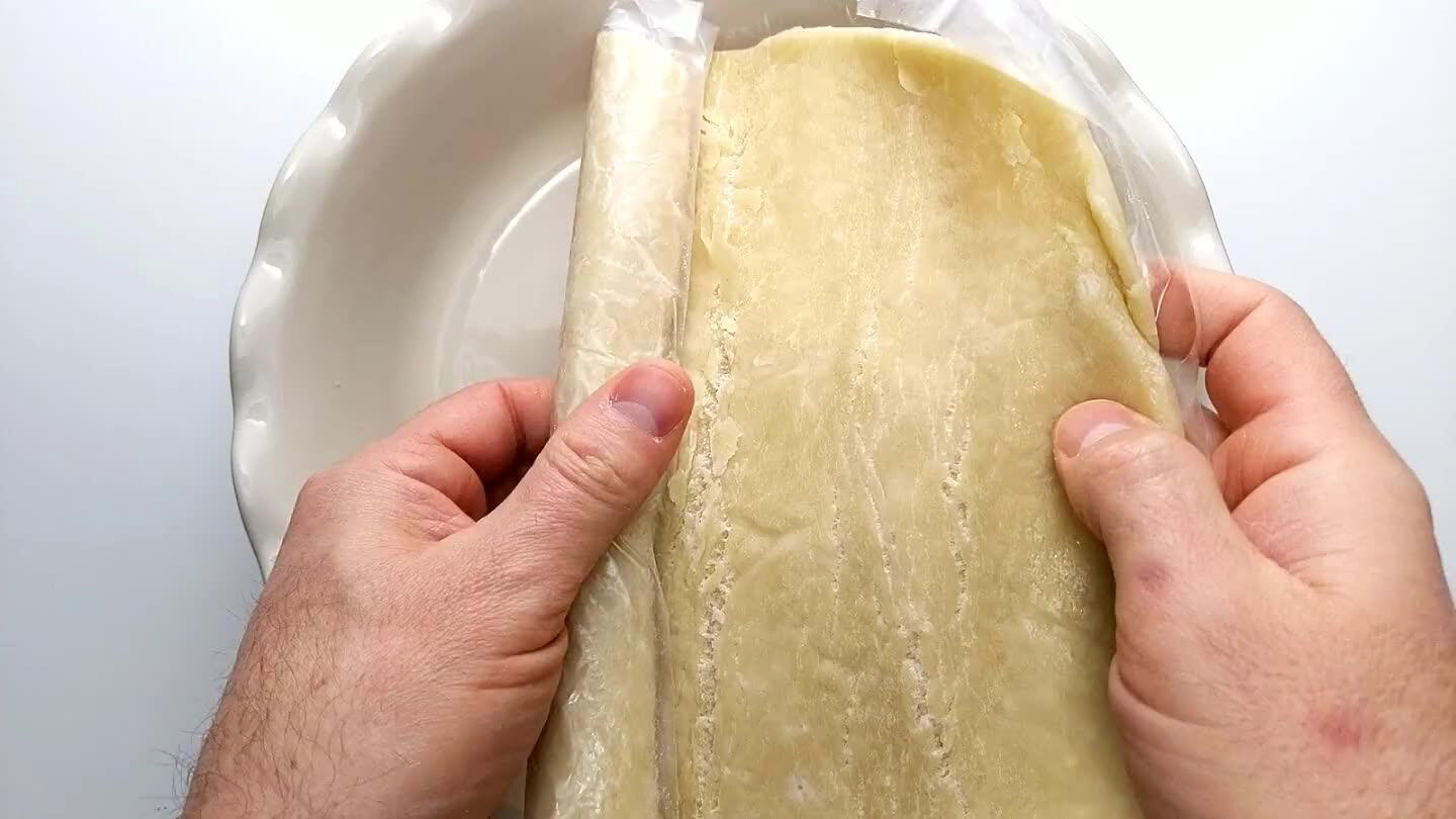 move any air pockets. Shape it up the sides of the pie dish.