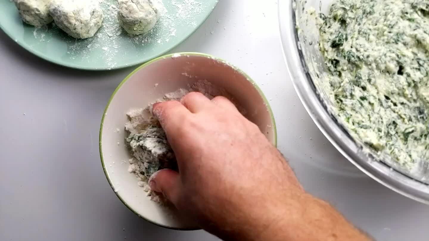 your palms. Set each dumpling aside on a plate dusted in flour.