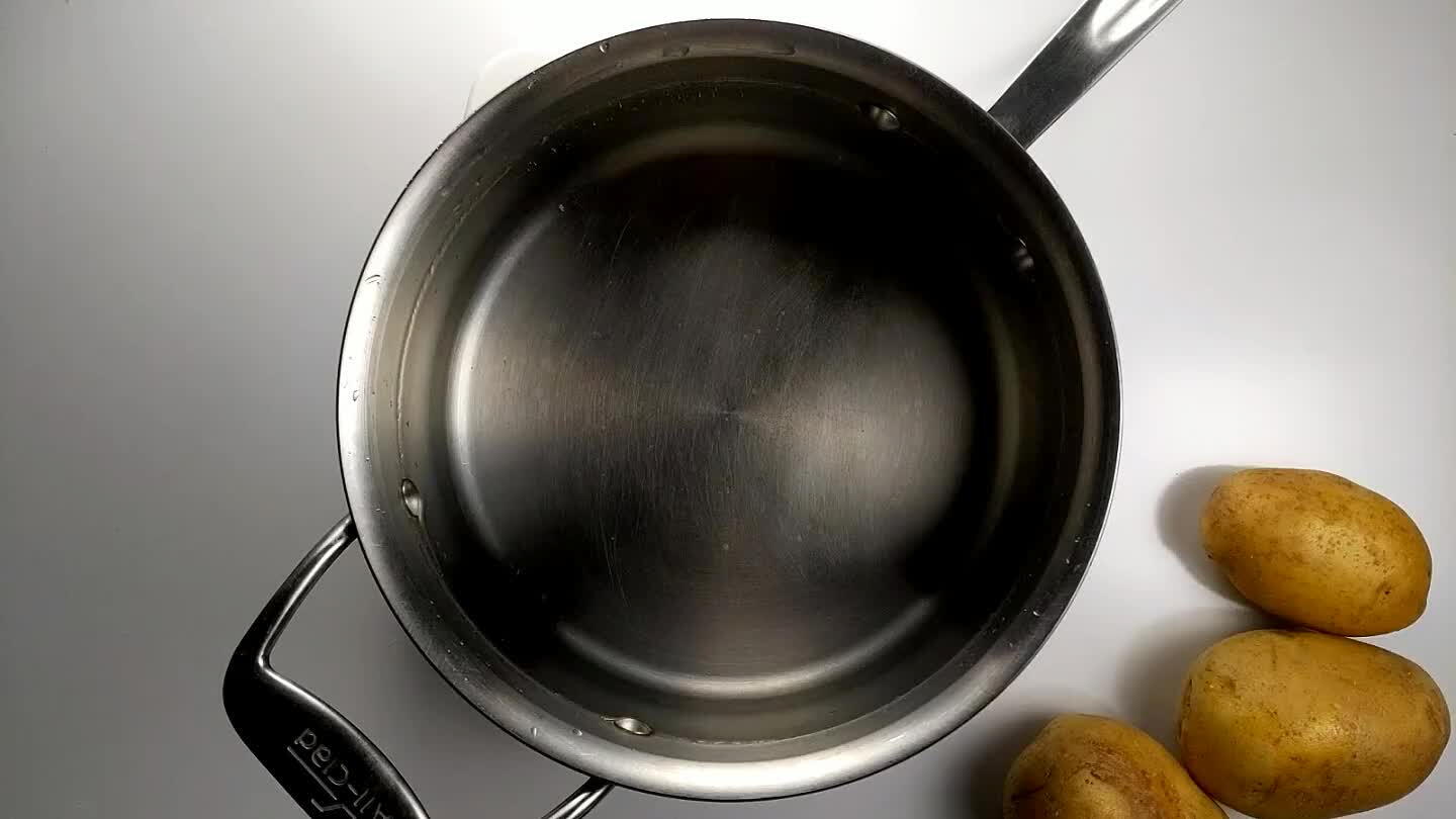 ot over medium heat. Set a timer for 45 minutes. If the water begins to boil, reduce the temperature to hold the water at a very gentle simmer. Potatoes are done cooking when a knife or cake tester passes into the center of the largest potato with little resistance.