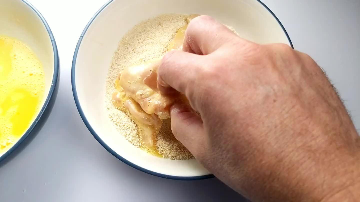 tely. Repeat this series to coat all of the chicken thighs in breading.