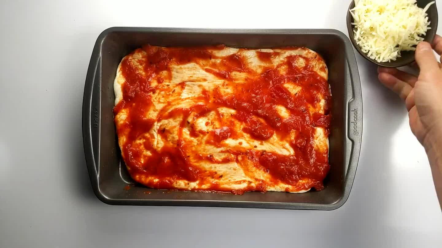 spy burnt cheese that forms at the edge of the pan is one of the key features of this style of pizza.