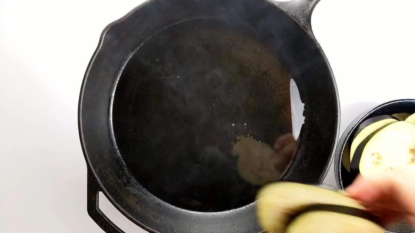 probably spatter, as the salt has pulled out some moisture. Searing eggplant takes some patience. It likes high heat and because it contains so much water, it can take awhile to brown.